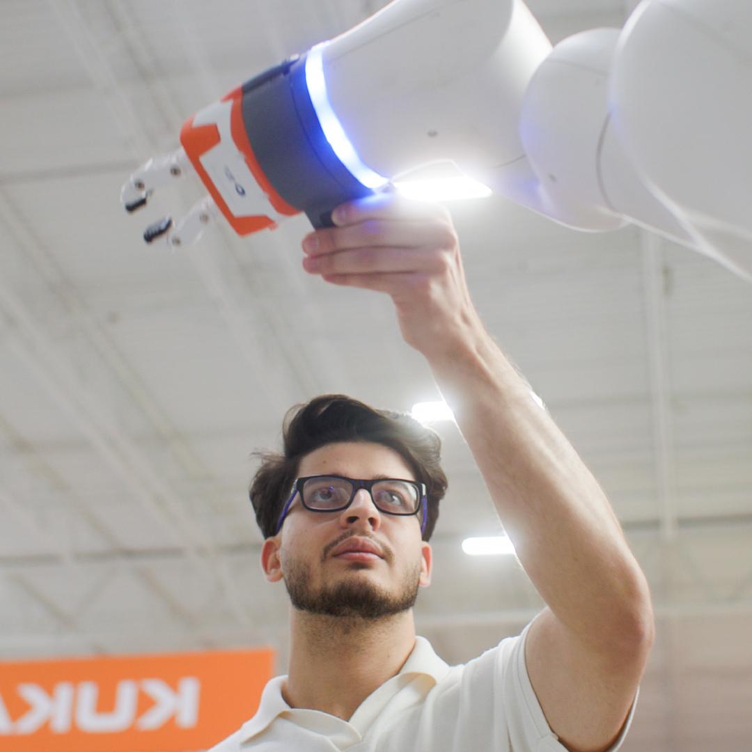 A man adjusting mechanical equipment